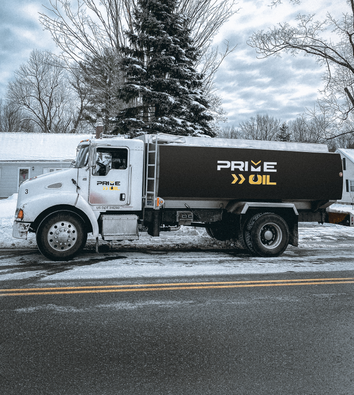 Prime Oil heating oil delivery truck parked on a snowy Springfield street